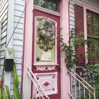 A pink door with a poster on it. 
