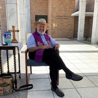 Image of a pastor set up outside for a church service.