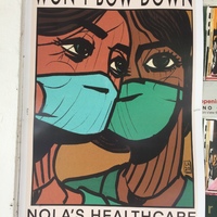 A poster of two healthcare workers with masks. 