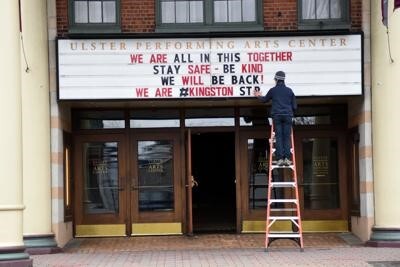 A local theater marquee reading "We are all in this together. Stay safe- be kind. We will be back! We are #Kingston".