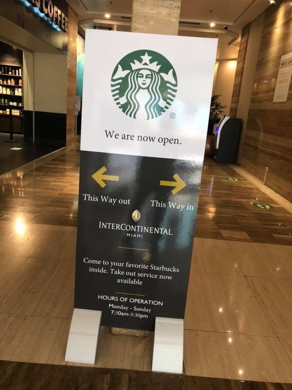 A Starbucks with a reopening sign. 