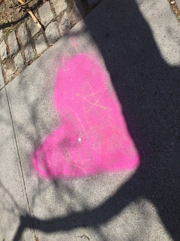 Chalk artwork on a sidewalk.