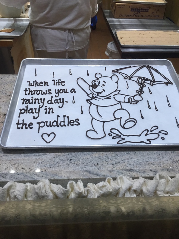 A tray that says "When life throws you a rainy day, play in the puddles".