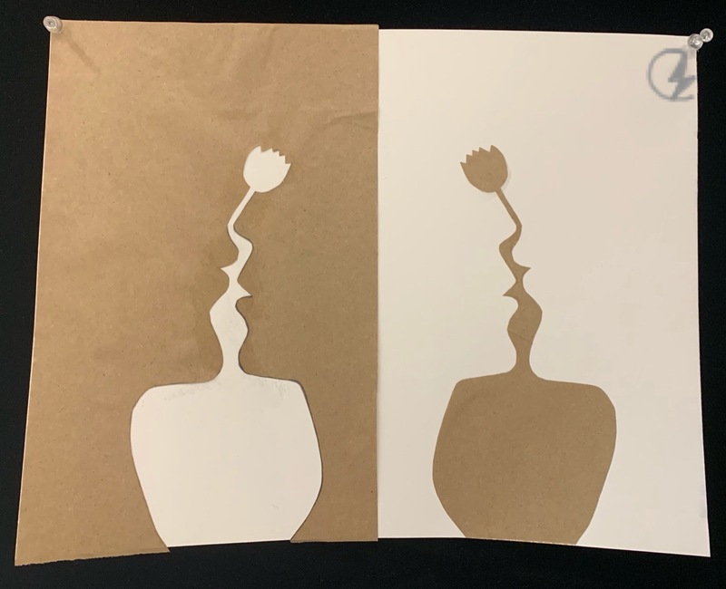 A brown and white piece of paper art. 