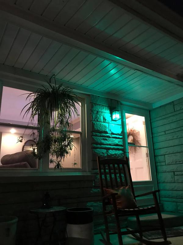 A house with a green light. 