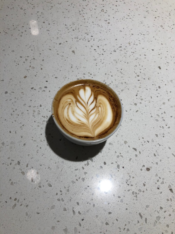 Latte with foam hearts.