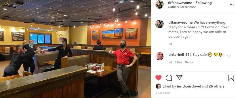 Screenshot of an Instagram post by @tiffanawesome with the caption "We have everything ready for a clean shift? Come down mates, I am so happy we are able to be open again!" with a photo of five employees in an Outback Steakhouse wearing masks. 