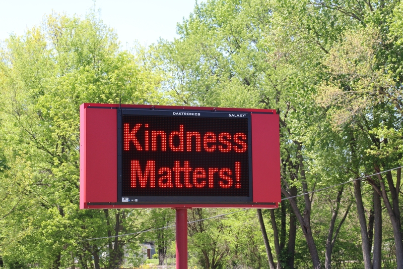 Digital sign reading "Kindness Matters".