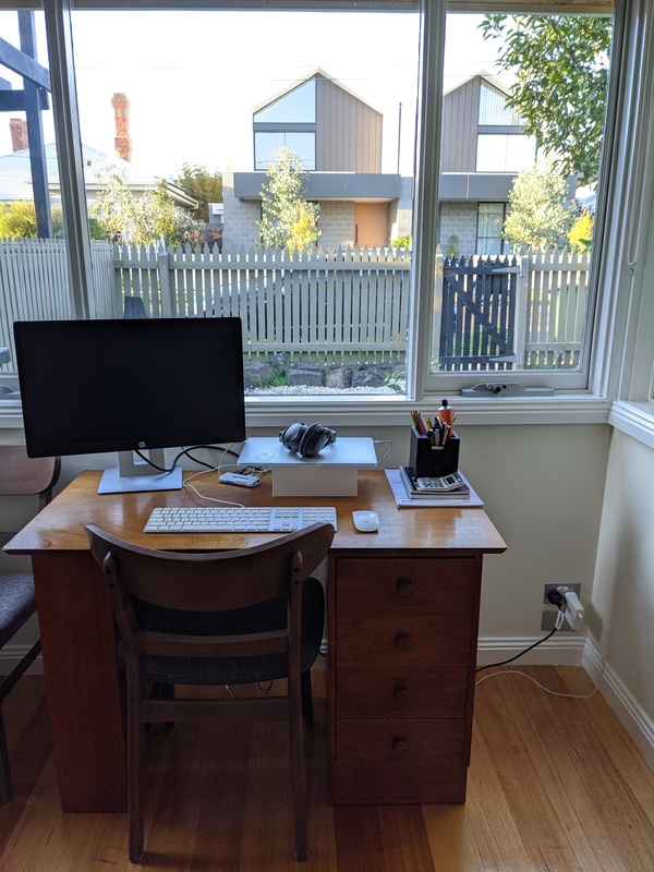 A desk with a computer in a home. 