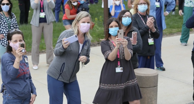 Crowd of Lahey hospital staff outside and all wearing facemasks.
