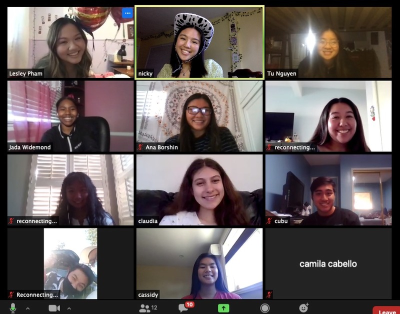 A screenshot of several smiling people on a Zoom call.