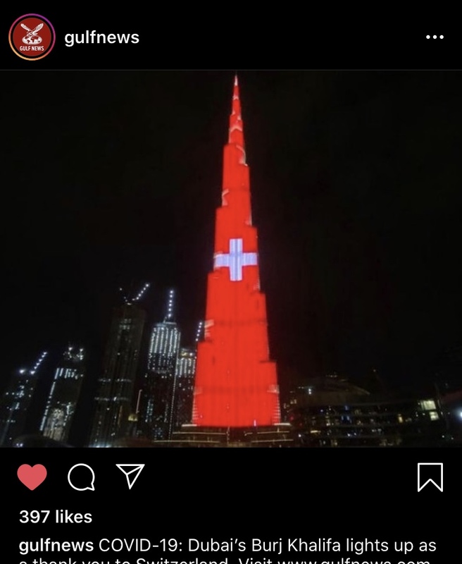 A tower with a red background and a white cross on it