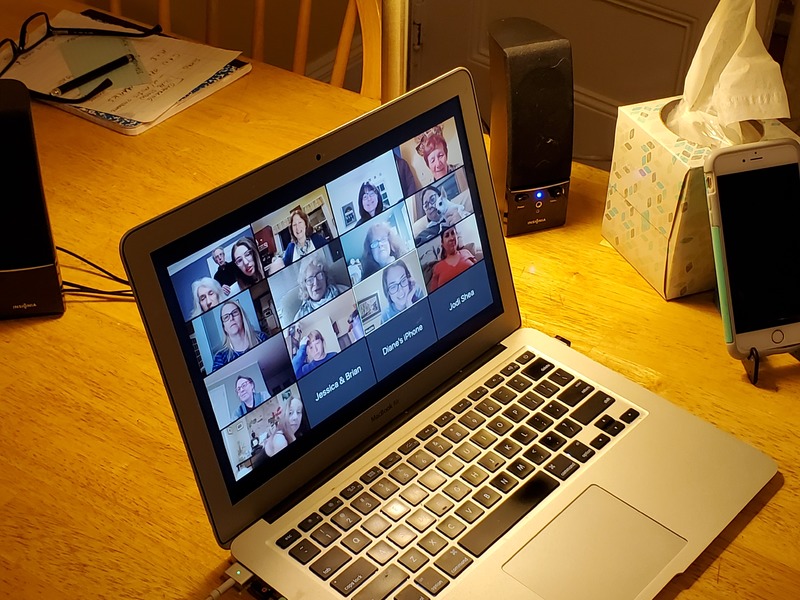 A zoom meeting on a laptop.