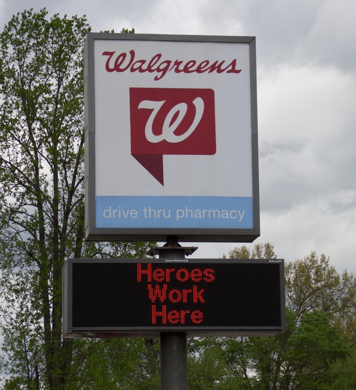 Sign outside a Walgreens reading "Heroes Work Here".