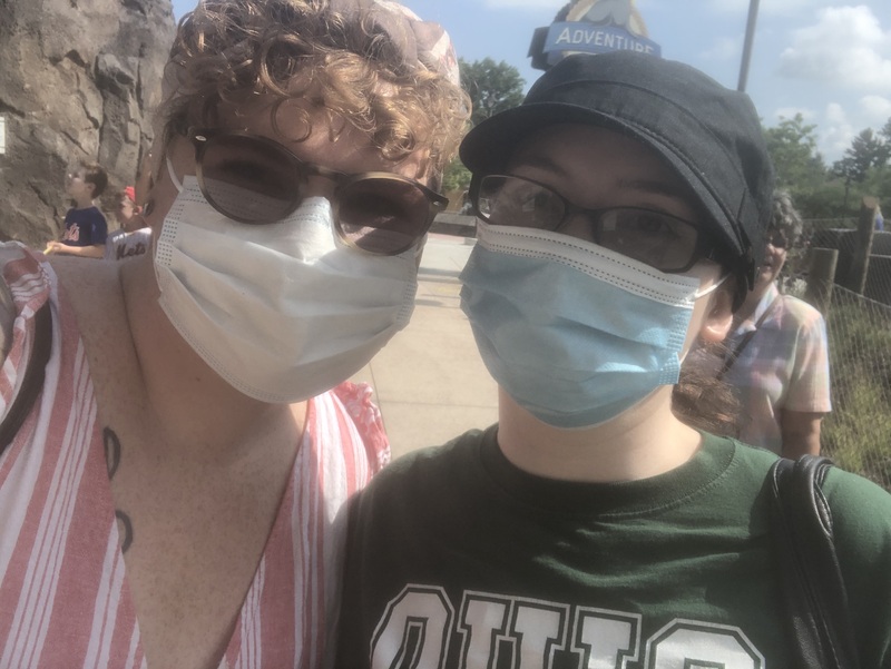 A photo of two masked people.