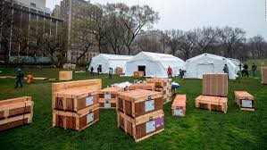 A field hospital and crates of supplies. 