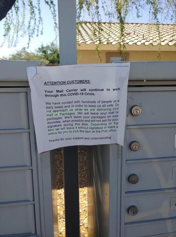 A note in front of mailboxes posted by the mail carrier. 