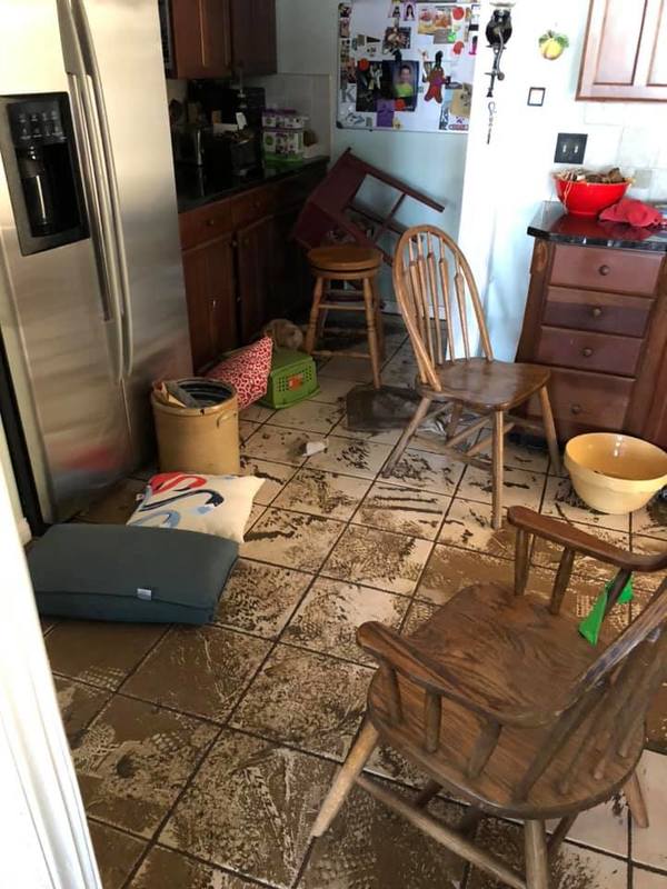 Image of a muddy kitchen after a flood.