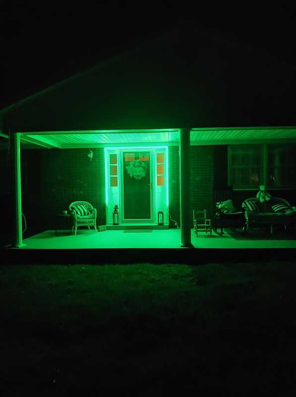 A door with green lights around it. 