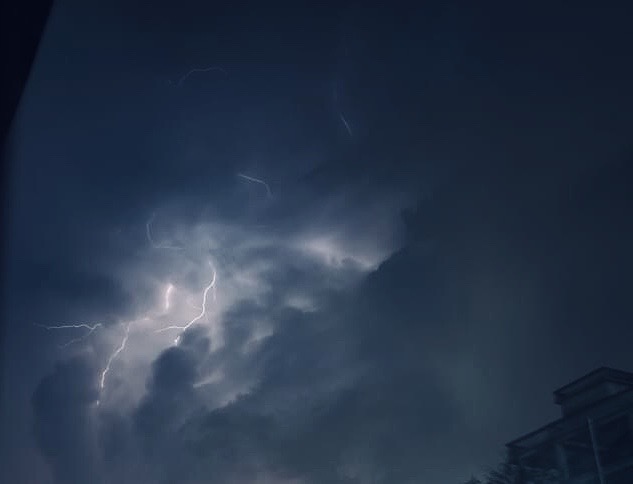 A thunderstorm in a cloudy sky. 