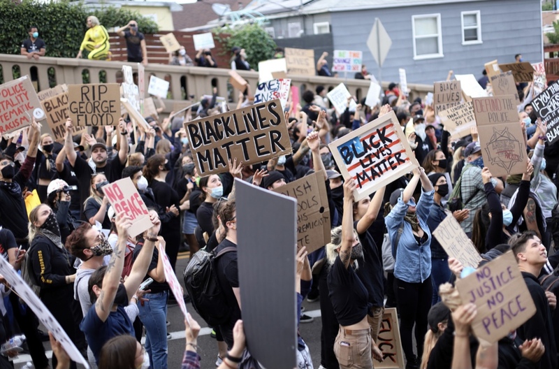 This is a picture taken of a group of protesters that are demonstrating on behalf of the Black Lives Matter movement. 
