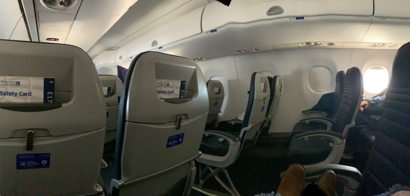 Picture of empty seats on an airplane during flight.