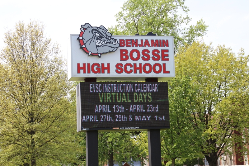 Sign at Benjamin Bosse High School reading "EVSC instruction calendar virtual days April 13 - April 23, April 27, April 29, and May 1".