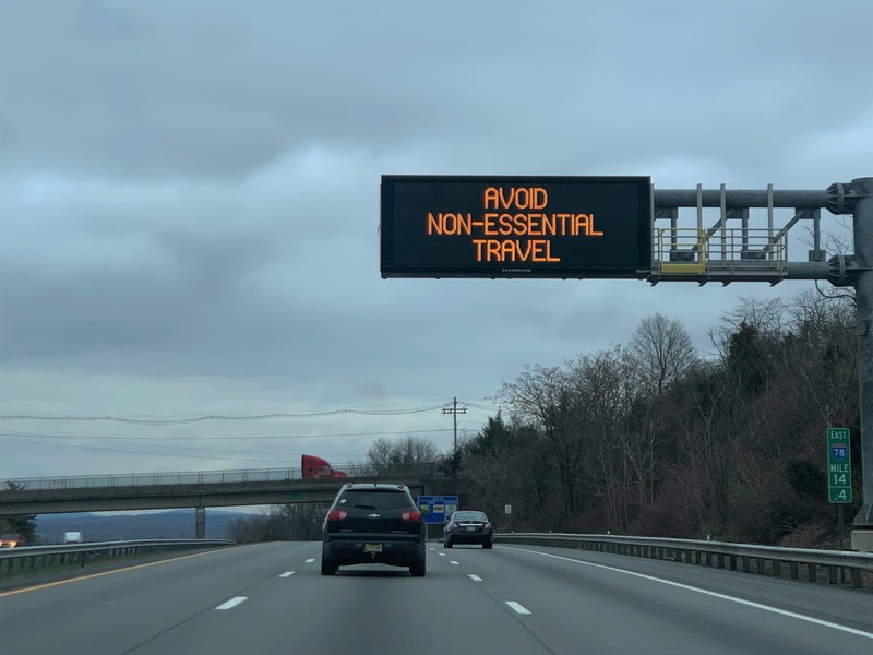A highway sign saying "avoid non essential travel". 
