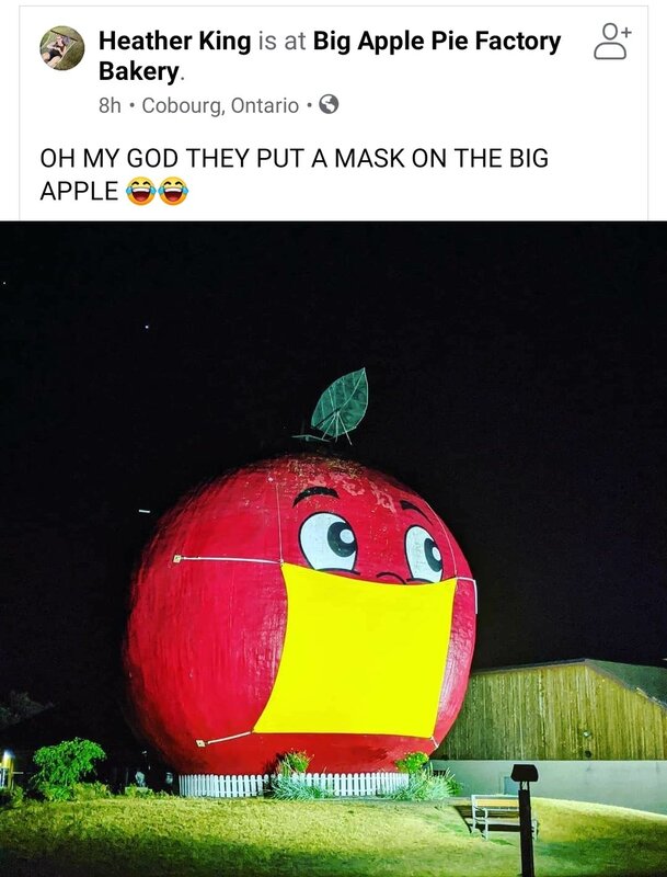 A social media post featuring a large apple with a mask. 