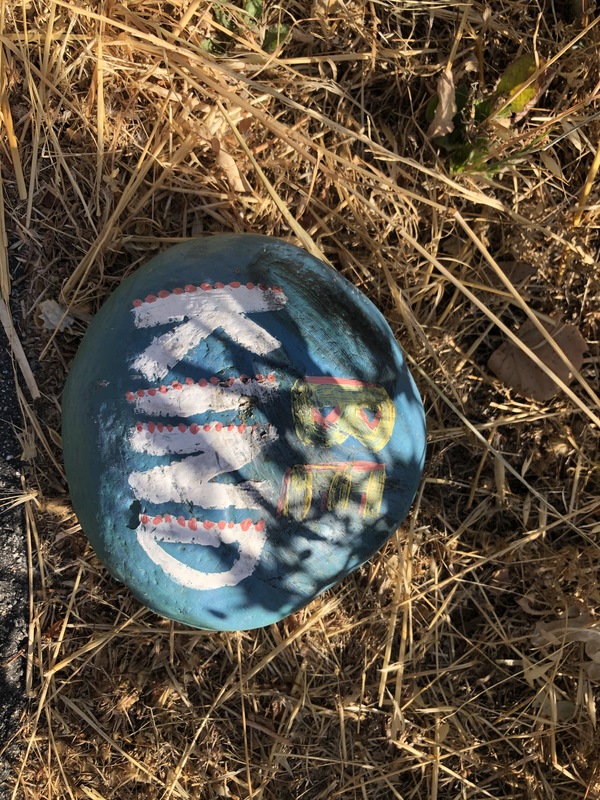 This is a picture of a rock painted blue. 