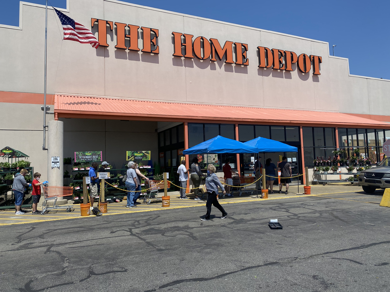 Photo of a line outside a Home Depot store. 