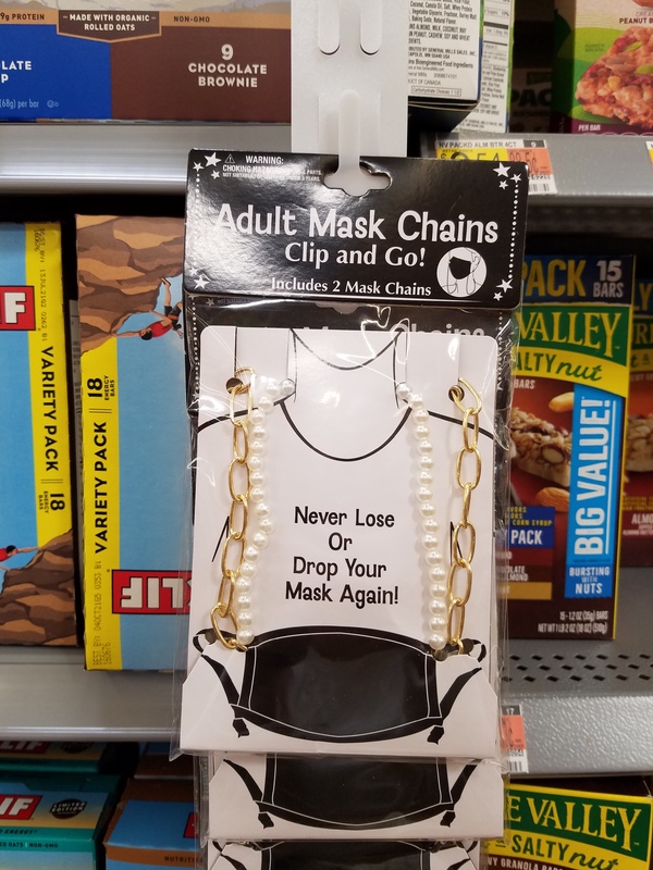This is a picture of a package of mask chains. Text on the packages reads: "Adult Mask Chains, Clip and Go! Includes 2 Mask Chains. Never Loose or Drop Your Mask Again!".  