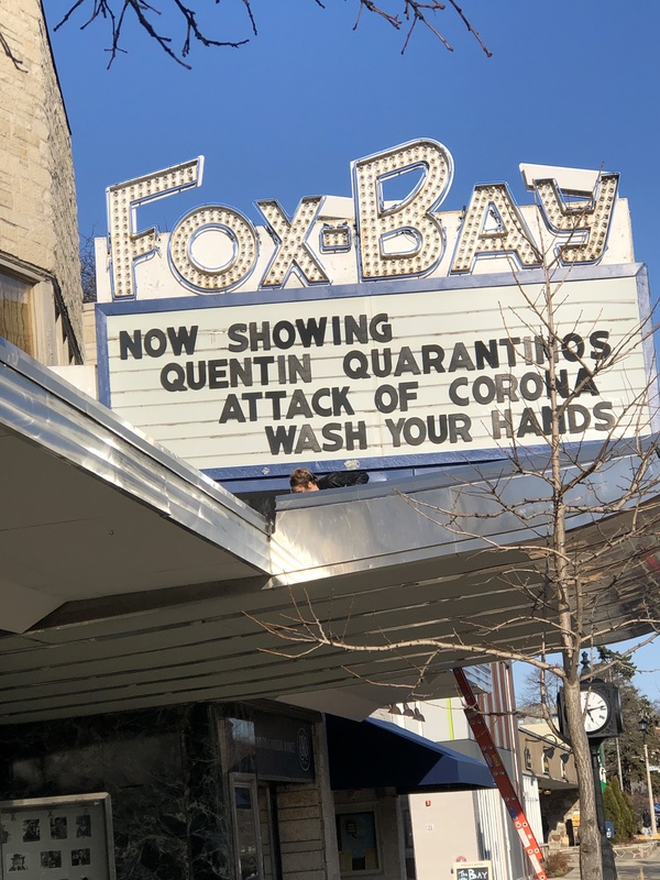 A theatre sign that has the words FOX-BAY above it. The sign says: NOW SHOWING QUENTIN QUARANTINOS ATTACK OF THE CORONA WASH YOUR HANDS.