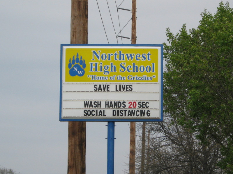 A high school's sign telling people to wash their hands