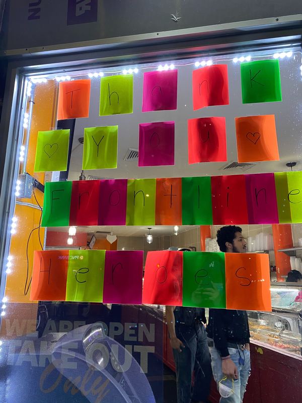 Message in window with sticky notes colored orange, pink, yellow, red, and green with text, "Thank You Frontline Heroes"
