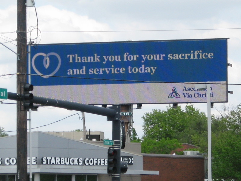 Billboard with a heart next to the words thank you for your sacrifice and service today.