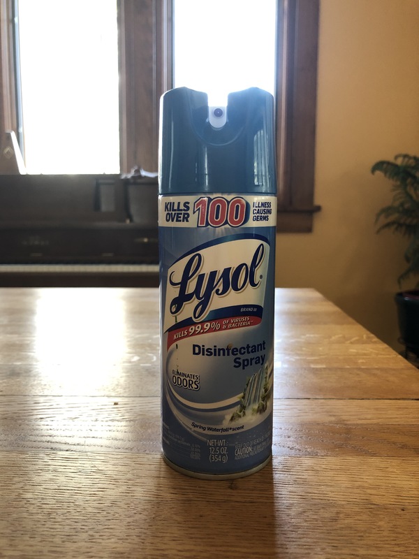 A can of Lysol disinfecting spray. 