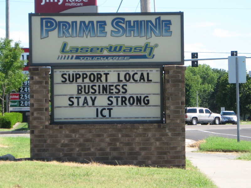 A sign saying "Support Local Business Stay Strong ICT".