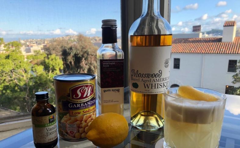 A cocktail and the ingredients used to make it. 