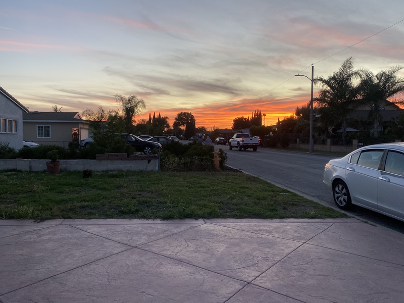 A photo of a neighborhood during sunset.