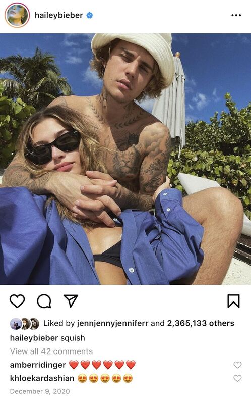 Screenshot of Hailey Bieber's Instagram post.  Photo of Justin and Hailey Bieber in bathing suits.