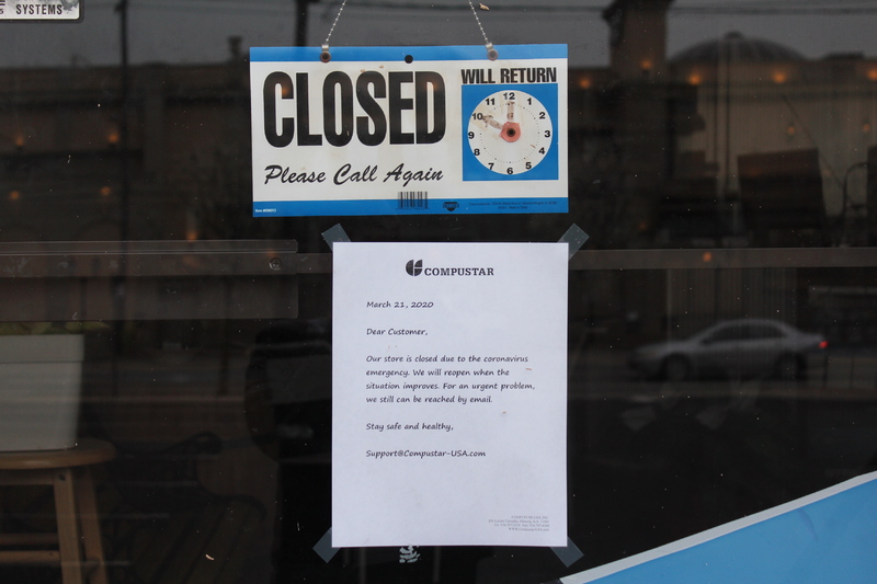 A closed sign with a memo underneath that says: 
"Compustar
March, 21, 2020.
Dear Customer,
 Our store is closed due to the coronavirus emergency. We will reopen when the situation improves. For an urgent problem, we can still be reached by e-mail. 
Stay safe and be healthy,
Support@Compustar-USA.com" 