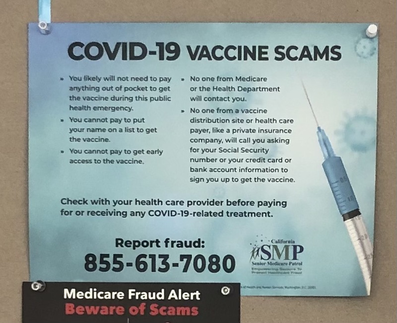 This is a picture of a sign warning the reader of COVID-19 vaccine scams. 