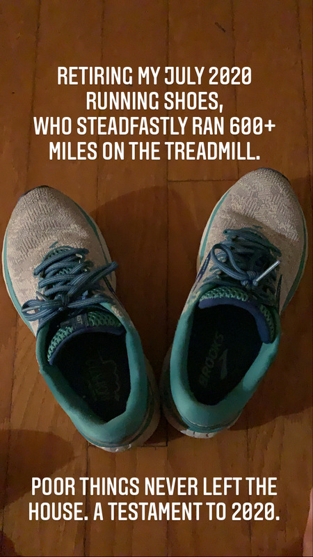This is a picture of a well worn pair of running shoes that are resting on wood flooring. The caption reads: "Retiring my July 2020 running shoes, who steadfastly ran 600+ miles on the treadmill. Poor things never left the house. A testament to 2020."