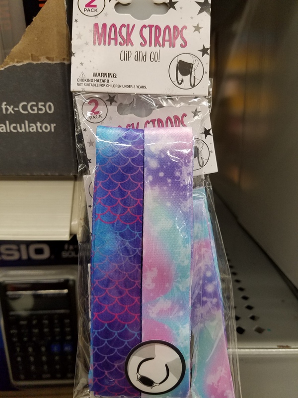 This is a picture of a package of brightly colored straps. A label on the reads "Mask Straps: Clip and Go Two Pack". 