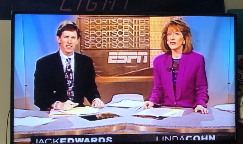 A man and a woman on a news broadcast. 