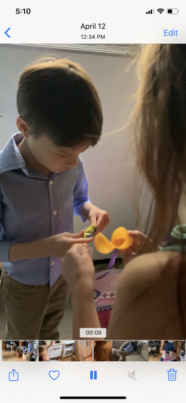 Screenshot of a video of a child opening Easter eggs.