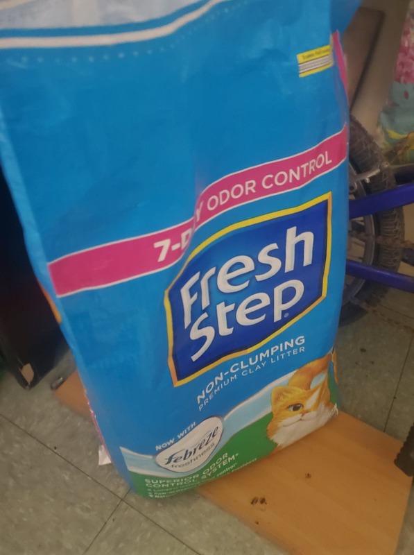 This is a picture of a blue bag of Fresh Step cat litter. 