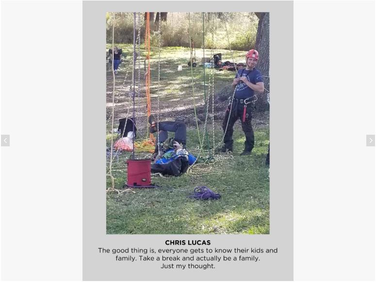 Photo of two people and ropes hanging from trees. 