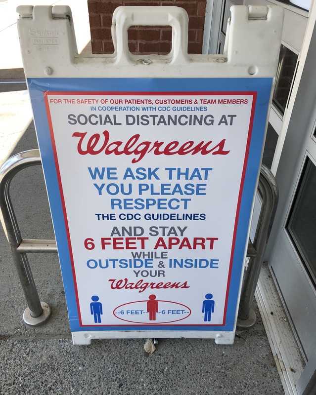 A sign about social distancing at Walgreens. 